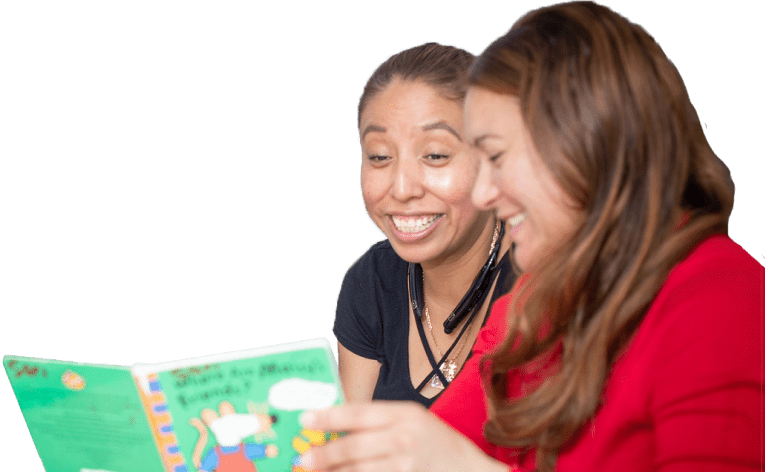 Two parents reading a picture book